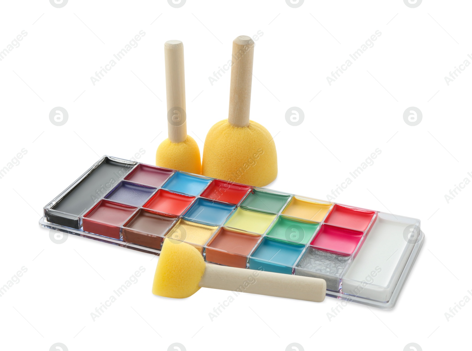 Photo of Bright face paint palette and sponges isolated on white