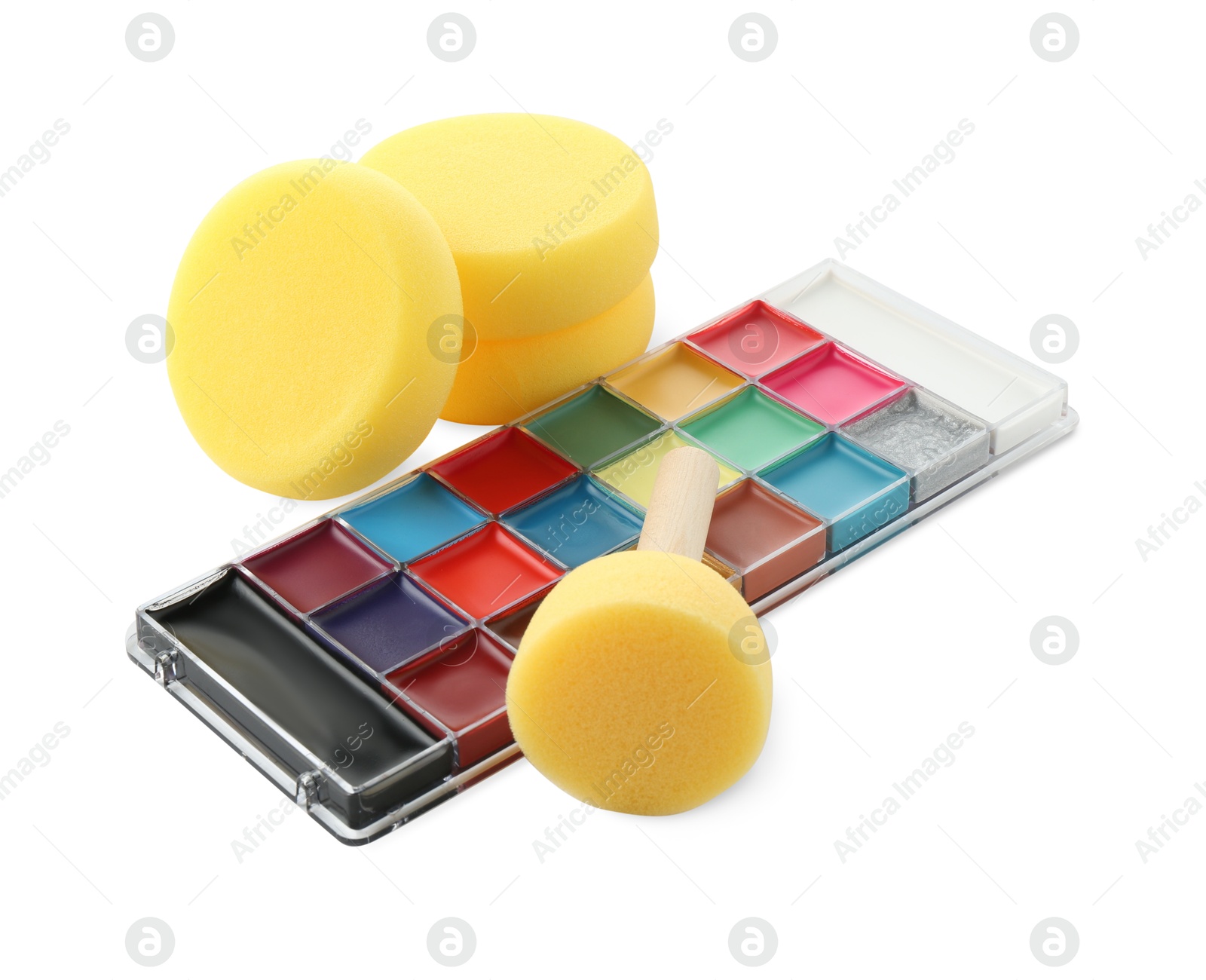 Photo of Bright face paint palette and sponges isolated on white