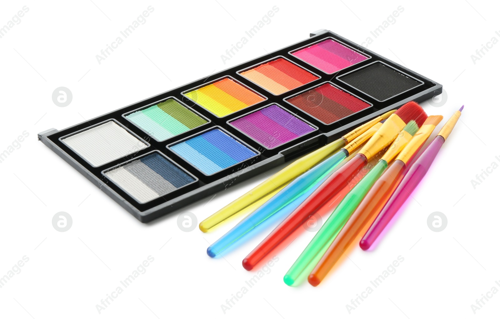 Photo of Bright face paint palette and brushes isolated on white