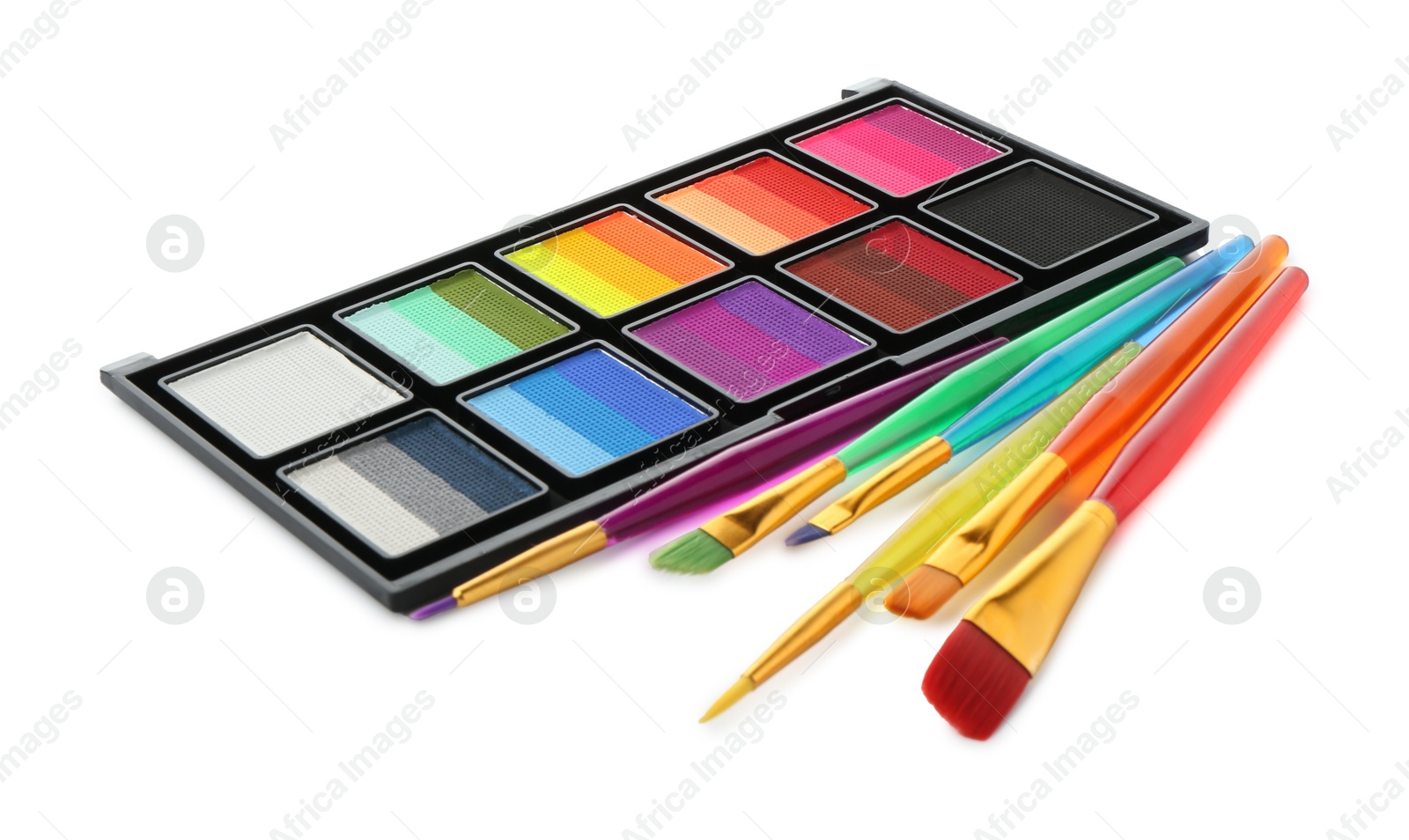 Photo of Bright face paint palette and brushes isolated on white