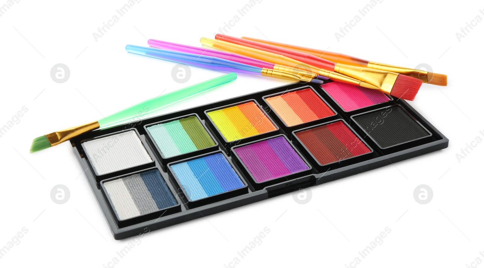 Photo of Bright face paint palette and brushes isolated on white