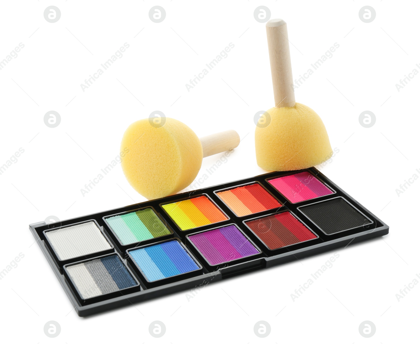 Photo of Bright face paint palette and sponges isolated on white