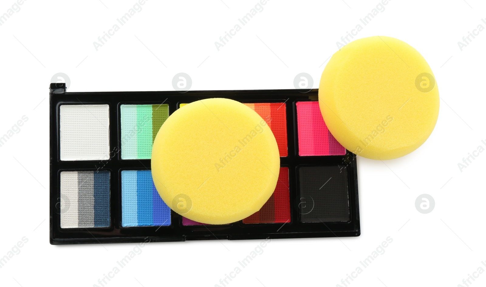 Photo of Bright face paint palette and sponges isolated on white, top view