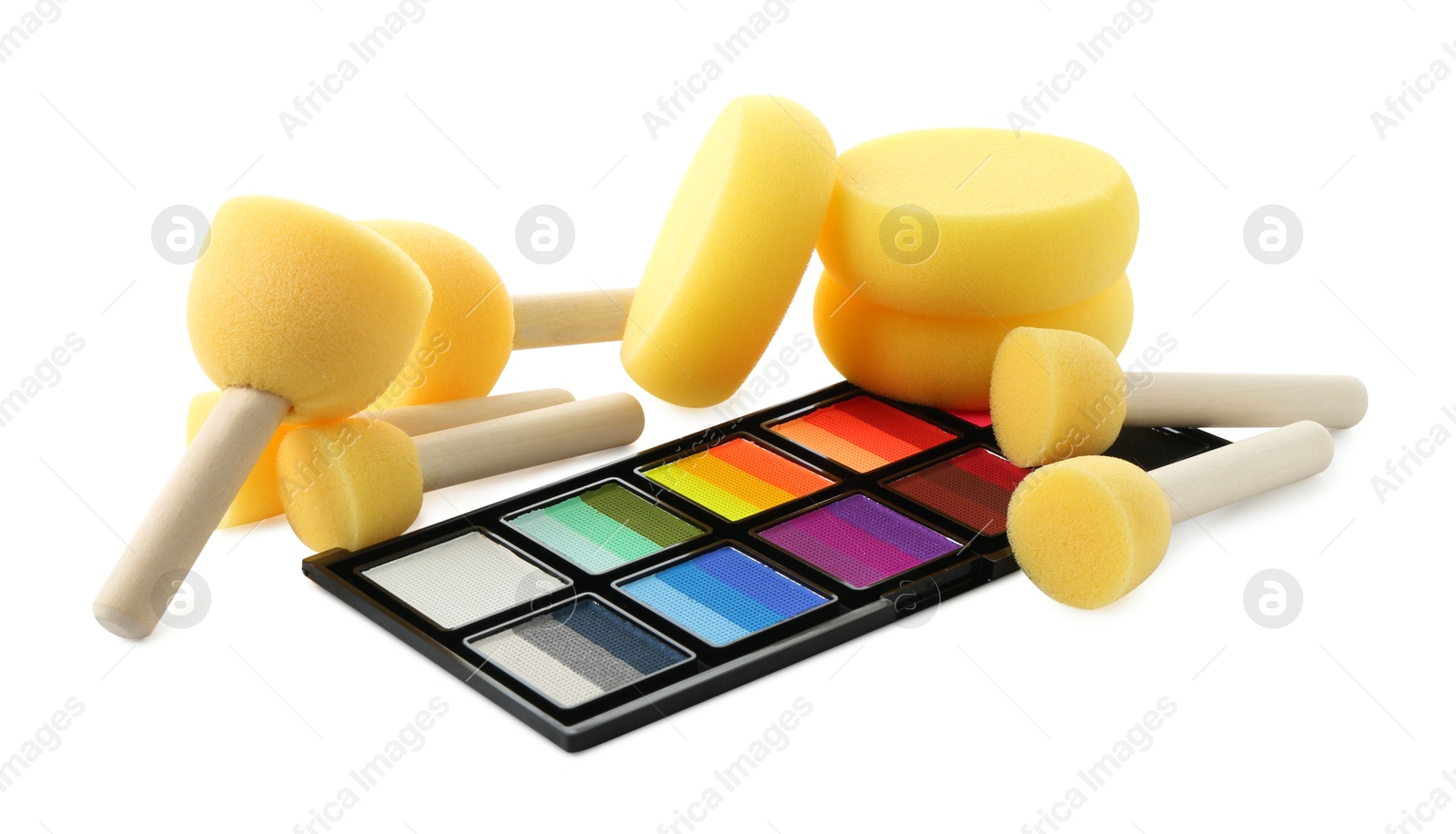 Photo of Bright face paint palette and sponges isolated on white