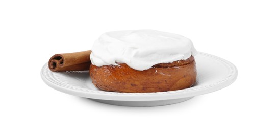 Photo of Tasty cinnamon roll with cream and stick isolated on white