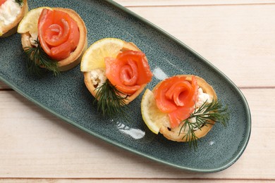 Photo of Tasty tartlets with delicious filling on wooden table, top view