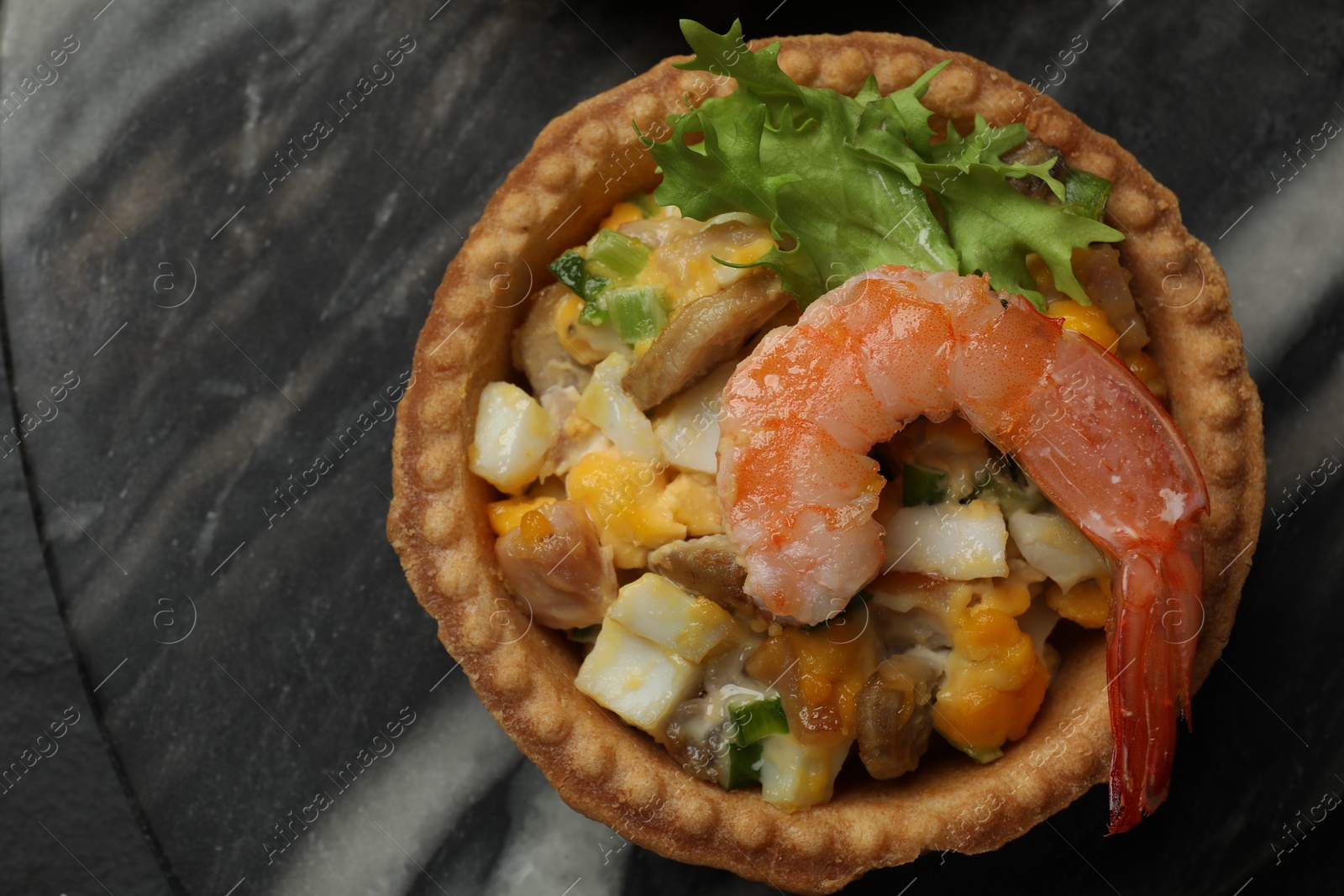 Photo of Tartlet with delicious filling on table, top view