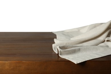 Photo of Light tablecloth on wooden table against white background, closeup