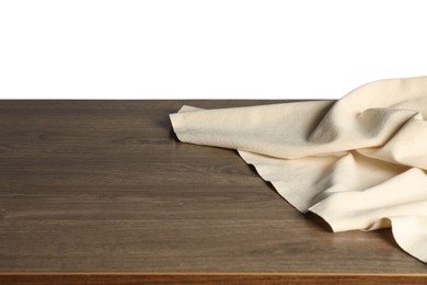 Photo of Beige tablecloth on wooden table against white background, closeup