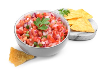 Delicious salsa in bowl and nacho chips isolated on white