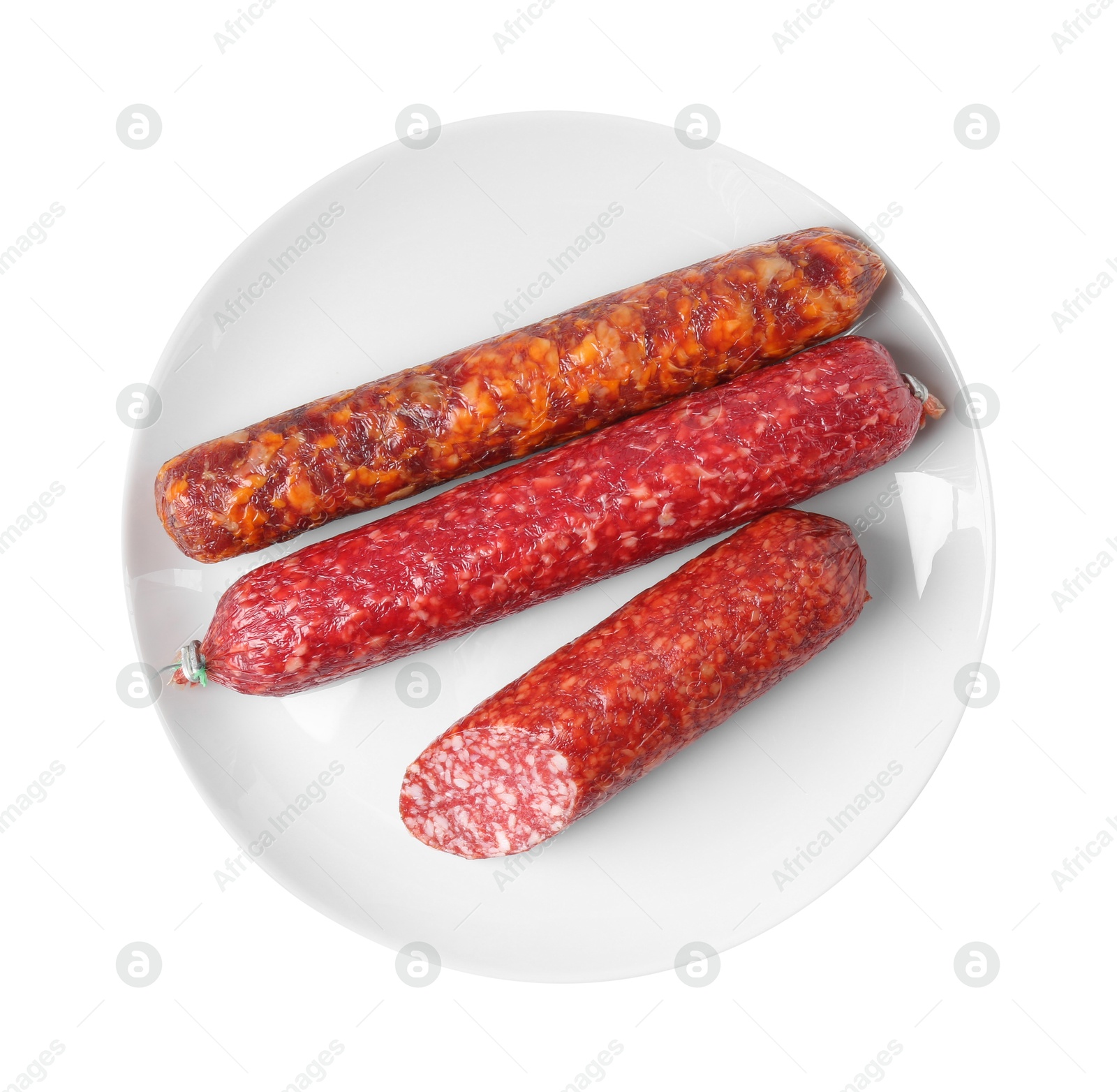 Photo of Many different smoked sausages isolated on white, top view