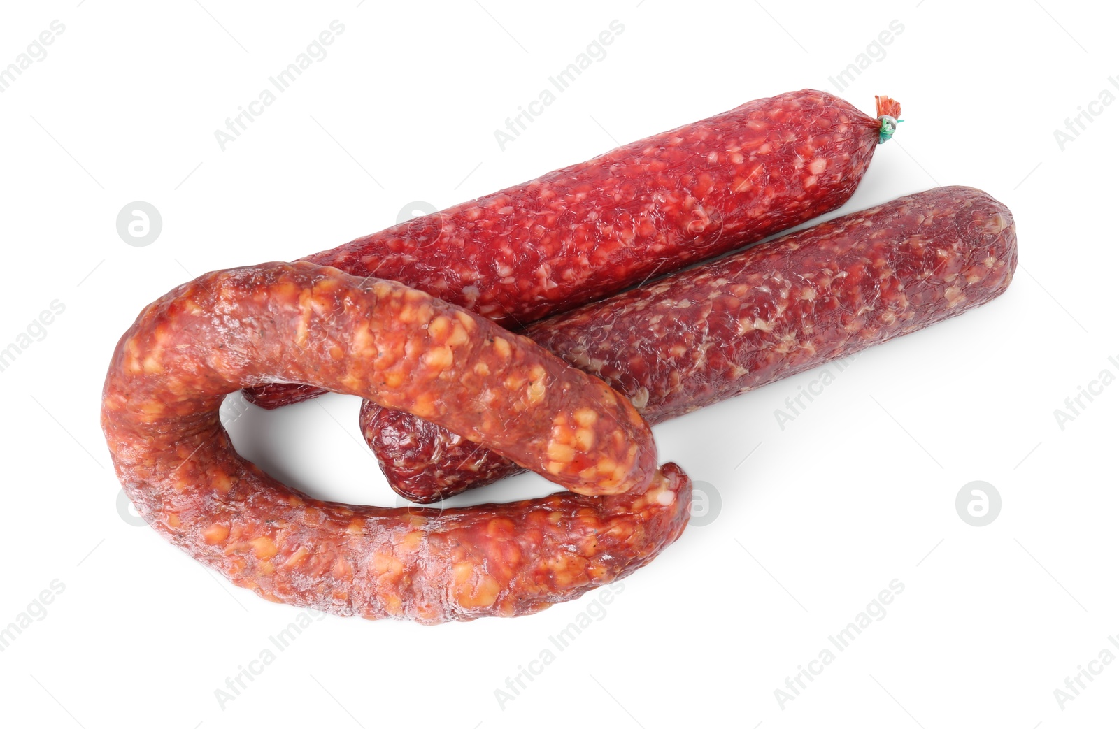 Photo of Many different smoked sausages isolated on white, top view