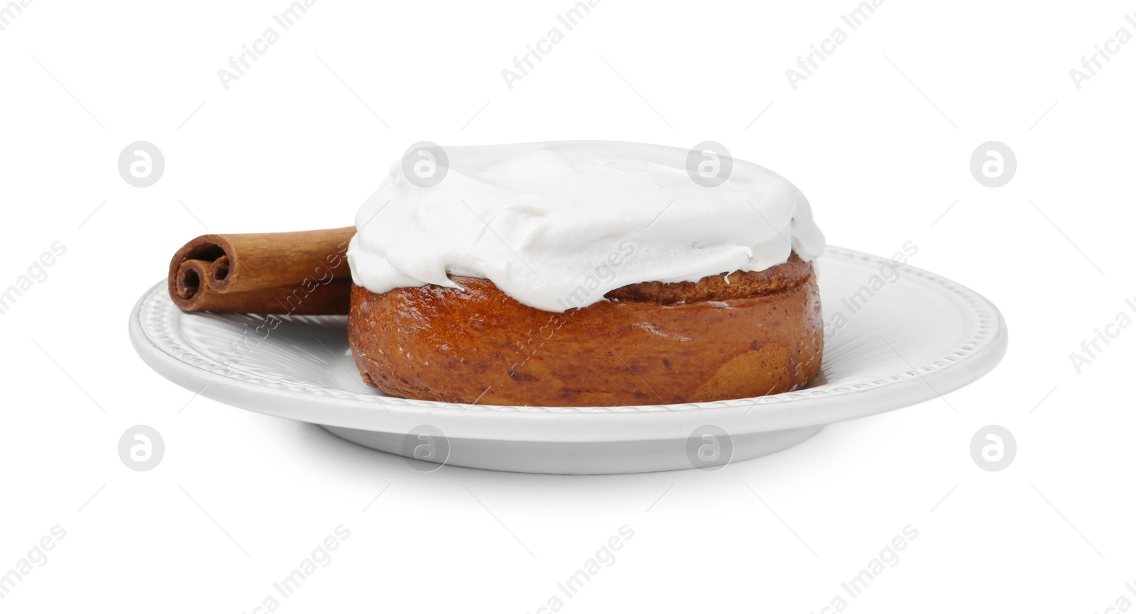 Photo of Tasty cinnamon roll with cream and stick isolated on white