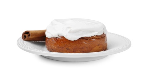 Photo of Tasty cinnamon roll with cream and stick isolated on white