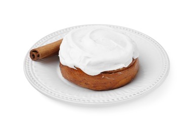 Photo of Tasty cinnamon roll with cream and stick isolated on white