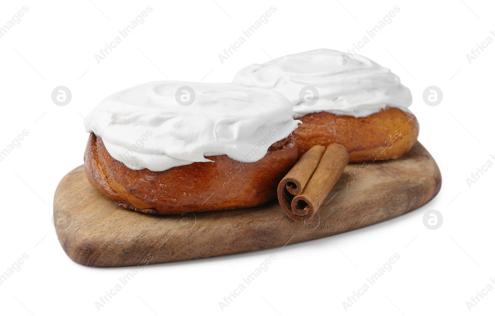 Photo of Tasty cinnamon rolls with cream and stick isolated on white