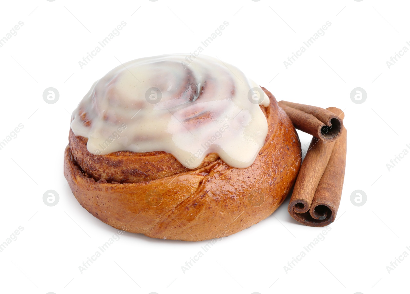 Photo of Tasty cinnamon roll with cream and spices isolated on white