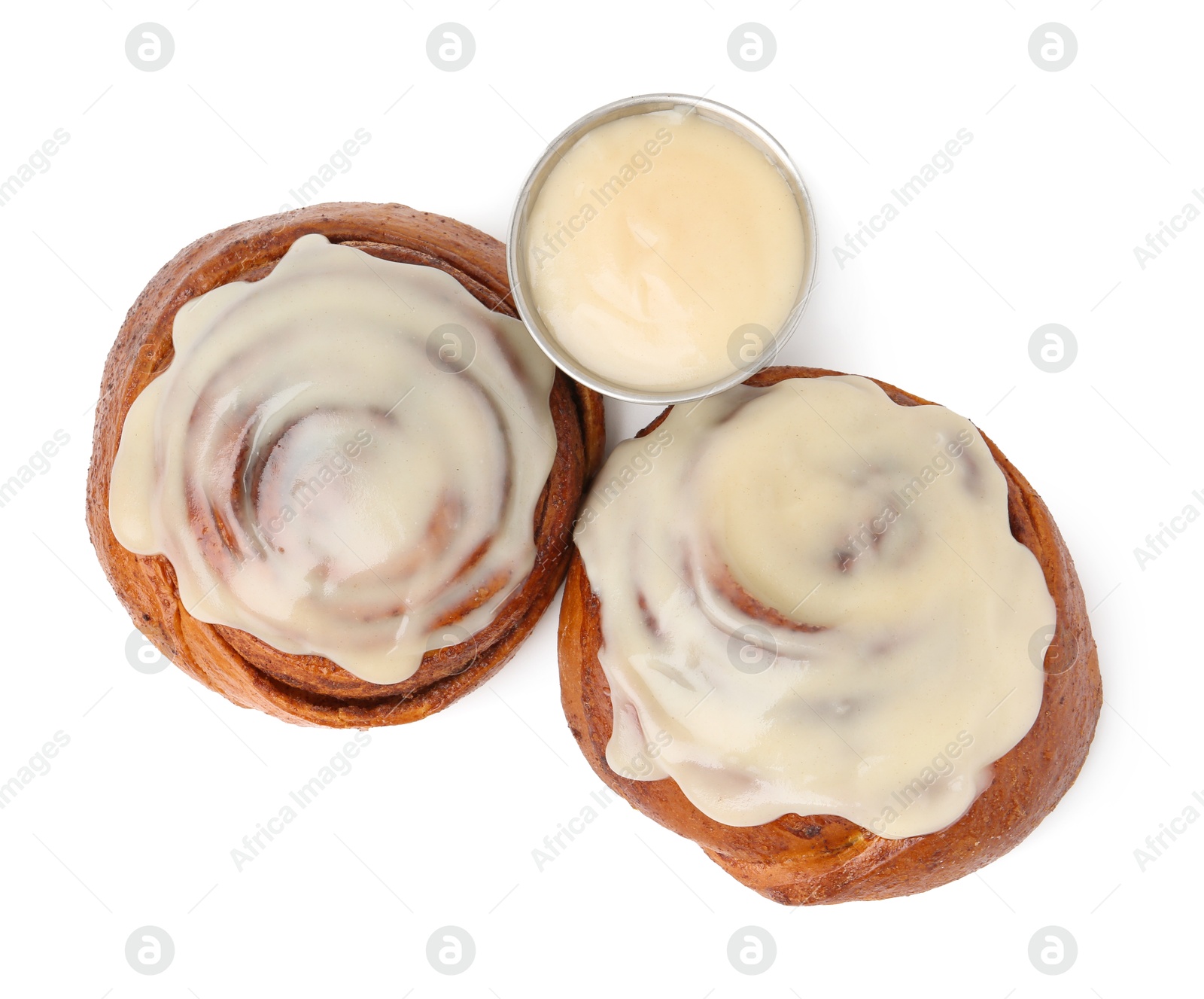 Photo of Tasty cinnamon rolls with cream isolated on white, top view