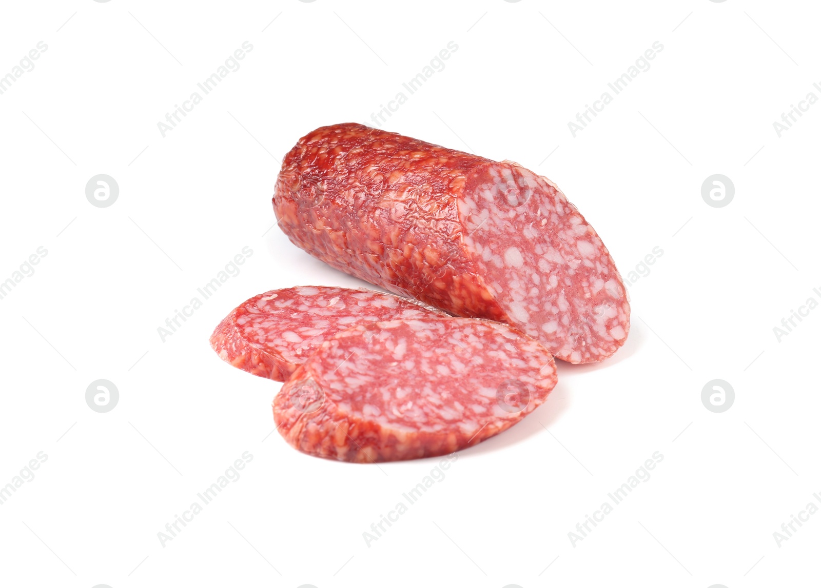 Photo of Pieces of delicious smoked sausage isolated on white