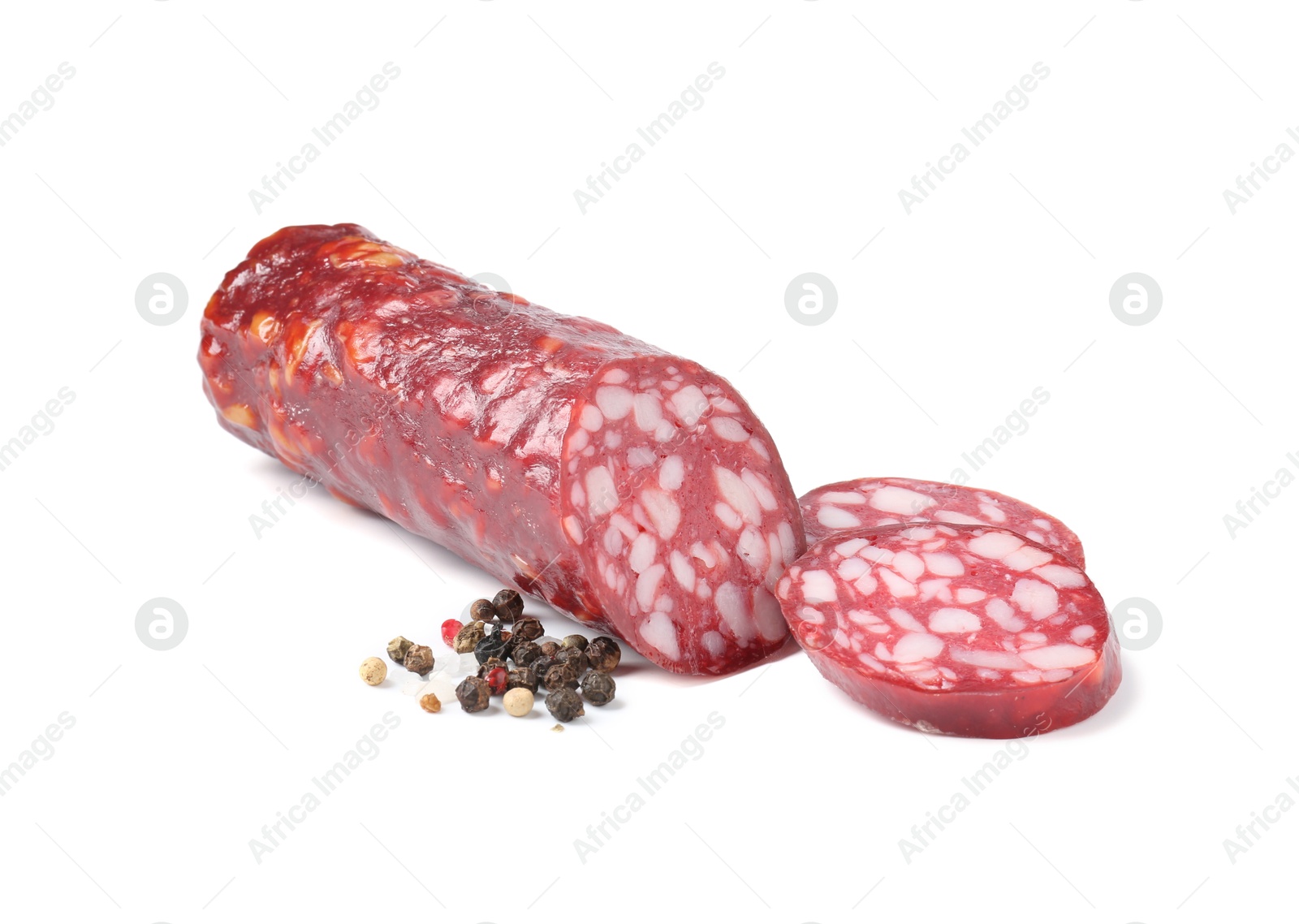 Photo of Delicious dry cured sausage and spices isolated on white