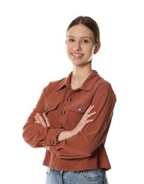 Photo of Portrait of smiling teenage girl with crossed arms on white background