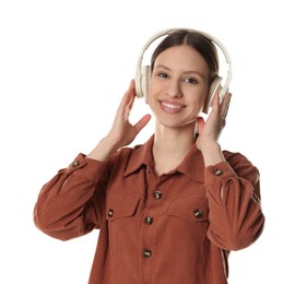 Photo of Portrait of smiling teenage girl listening to music on white background