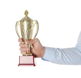 Man with golden trophy cup on white background, closeup