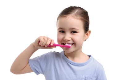 Photo of Cute girl brushing her teeth on white background