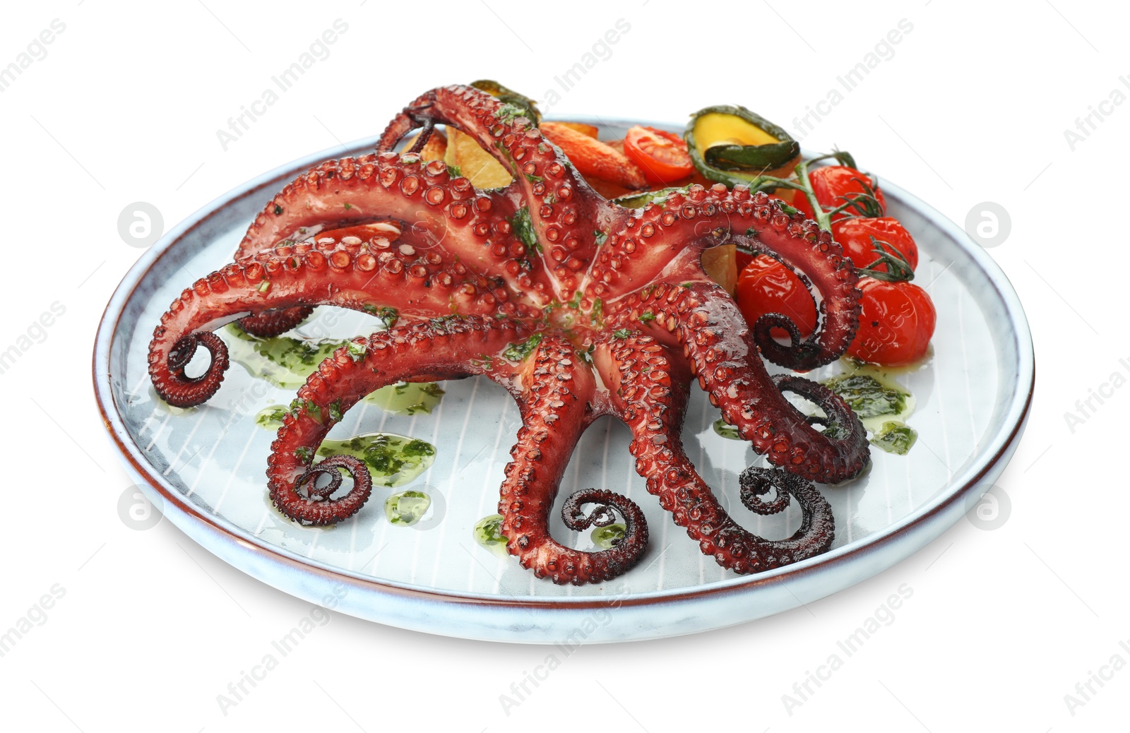 Photo of Fried octopus with herb sauce and vegetables isolated on white