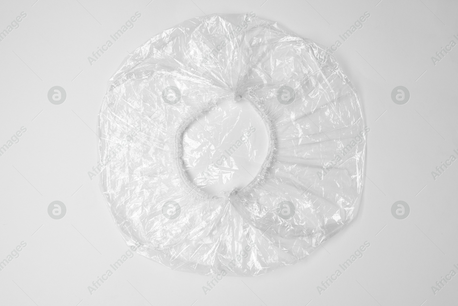 Photo of One shower cap isolated on white, top view