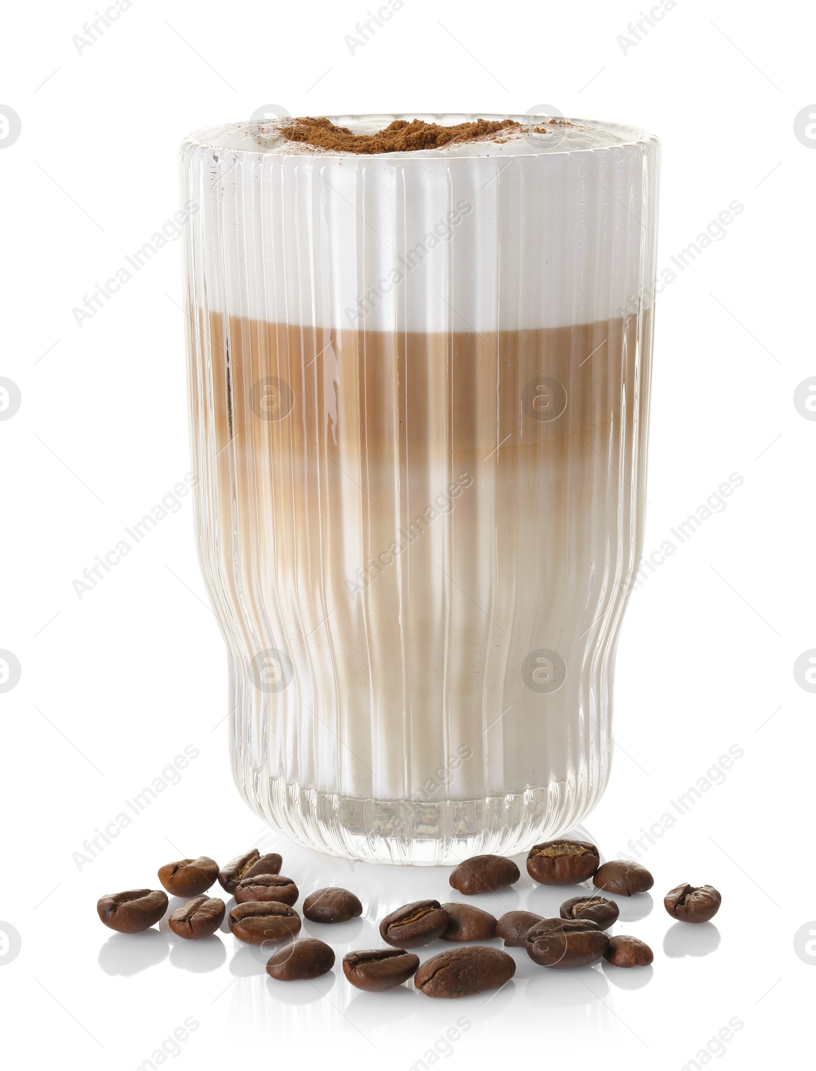 Photo of Tasty latte macchiato in glass and coffee beans isolated on white