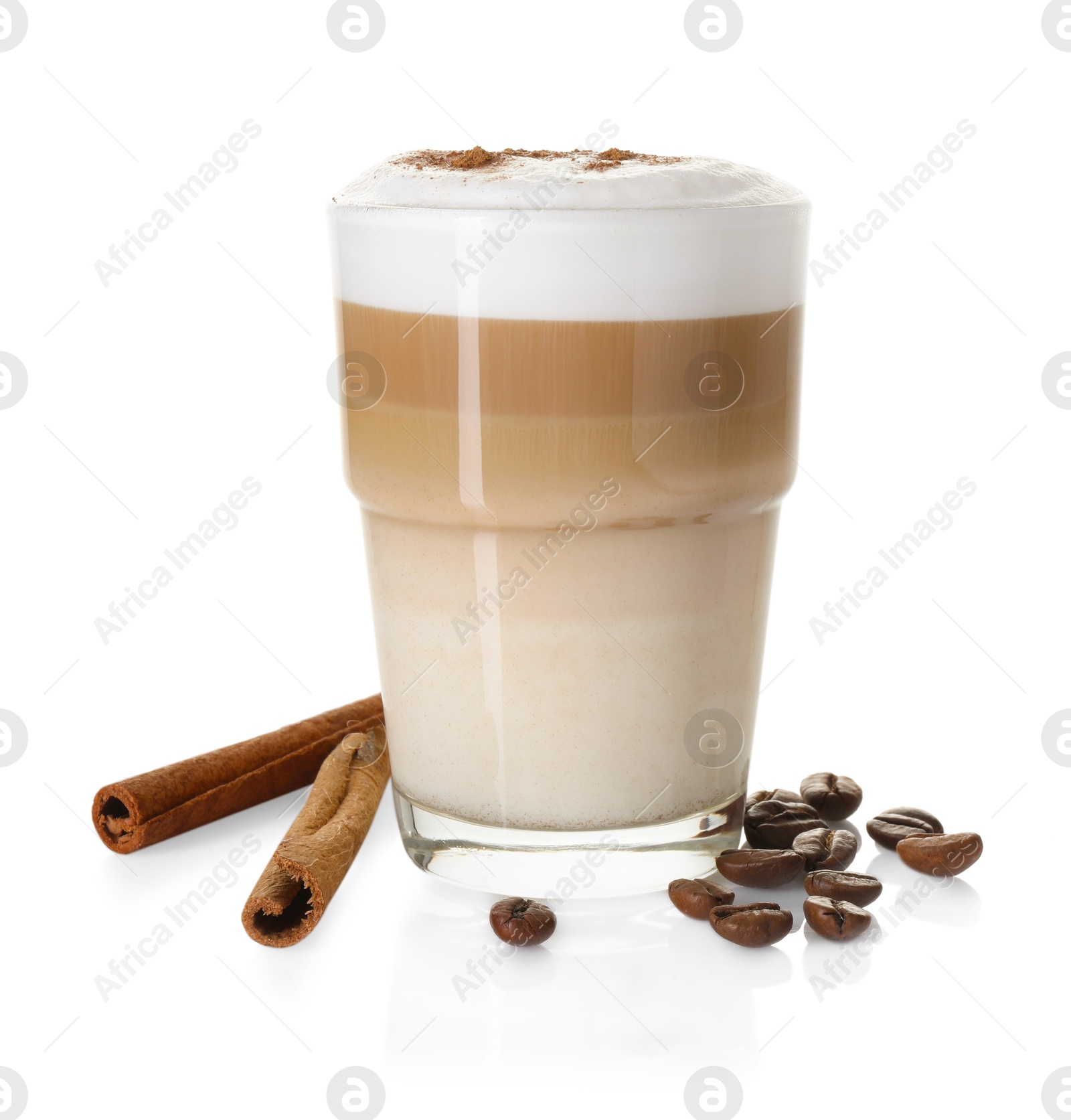 Photo of Tasty latte macchiato in glass, coffee beans and cinnamon isolated on white