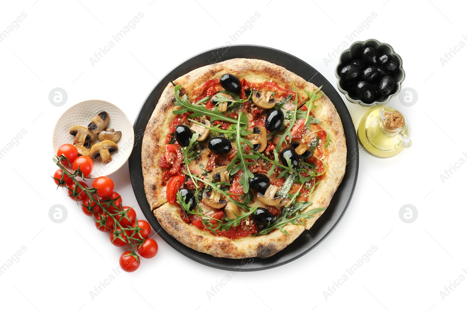 Photo of Tasty pizza with mushrooms, tomatoes, black olives and arugula isolated on white, top view