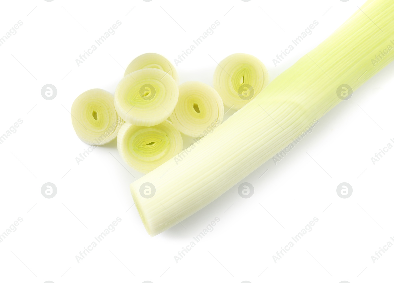 Photo of Whole and cut leeks isolated on white, top view