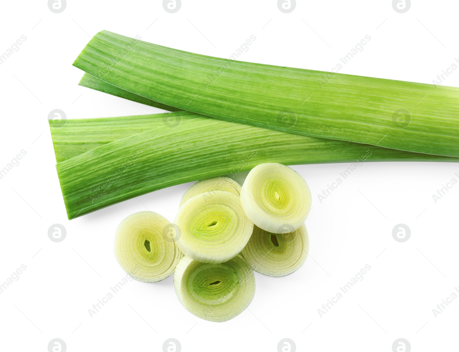 Photo of Whole and cut leeks isolated on white, top view