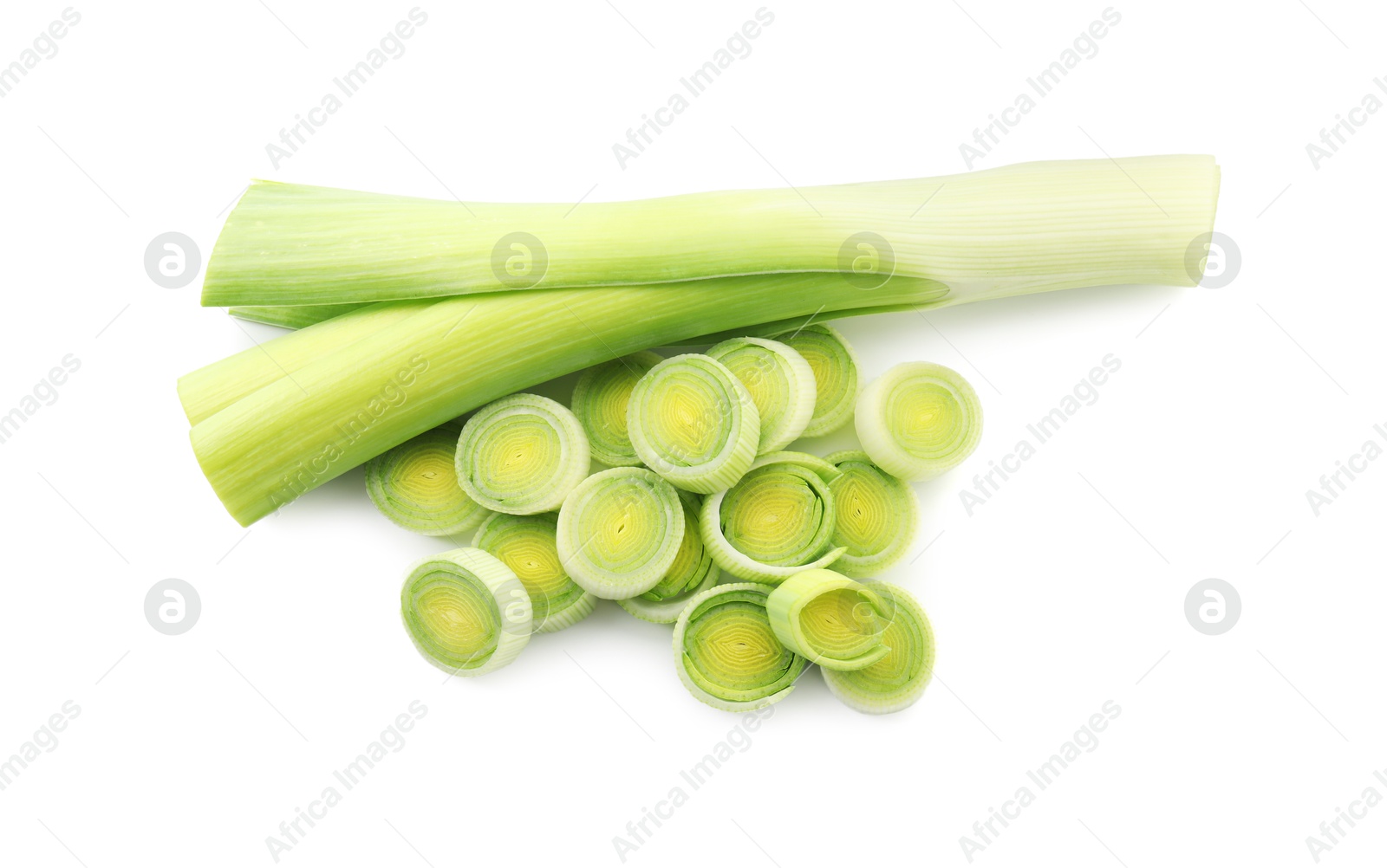 Photo of Whole and cut leeks isolated on white, top view