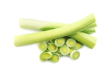 Photo of Whole and cut leeks isolated on white, top view