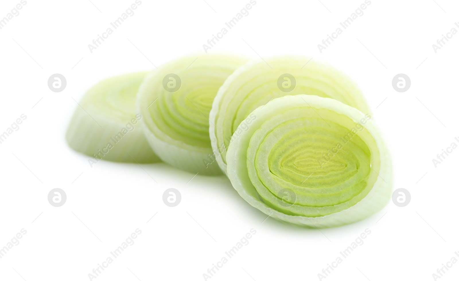 Photo of Pieces of fresh leek isolated on white