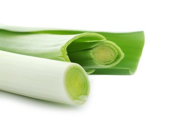 Photo of Two fresh leeks on white background, closeup