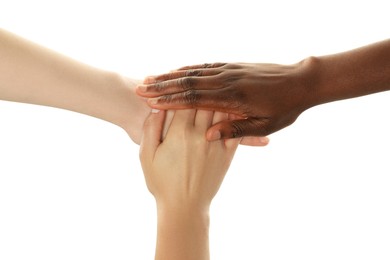 Photo of Stop racism. People of different skin colors joining hands on white background, closeup