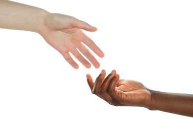 Photo of Stop racism. People of different skin colors joining hands on white background, closeup