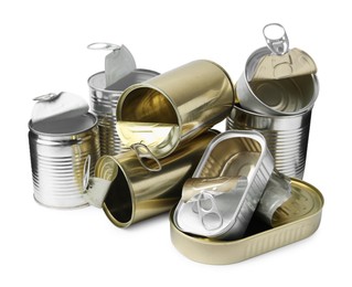 Photo of Many open tin cans isolated on white