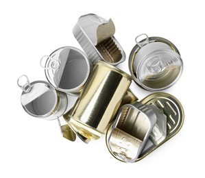 Photo of Many open tin cans isolated on white, top view