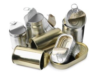 Photo of Many open tin cans isolated on white