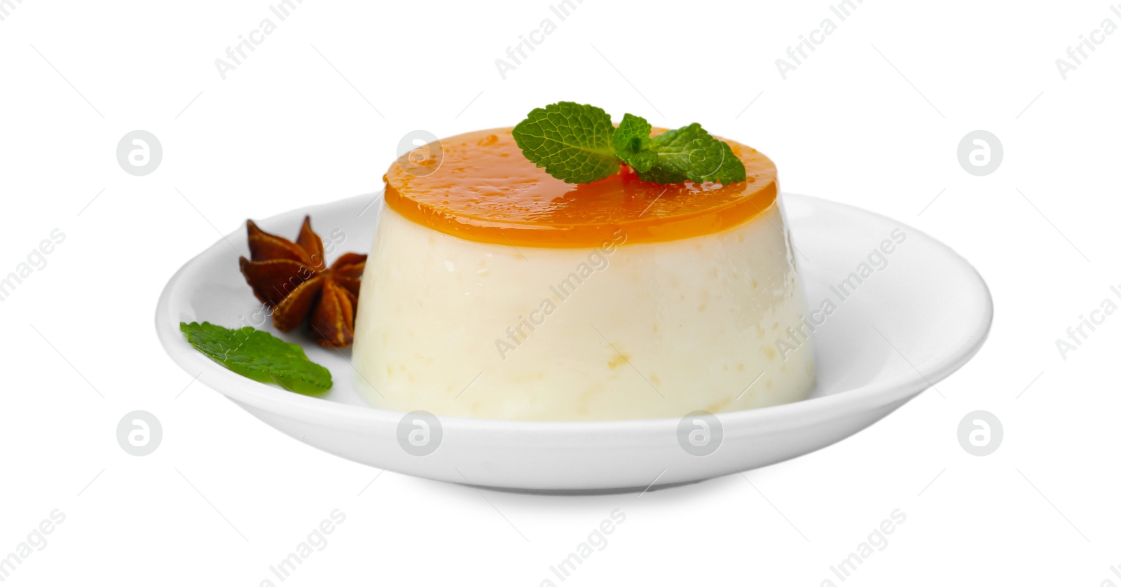 Photo of Tasty pudding with caramel sauce and mint isolated on white