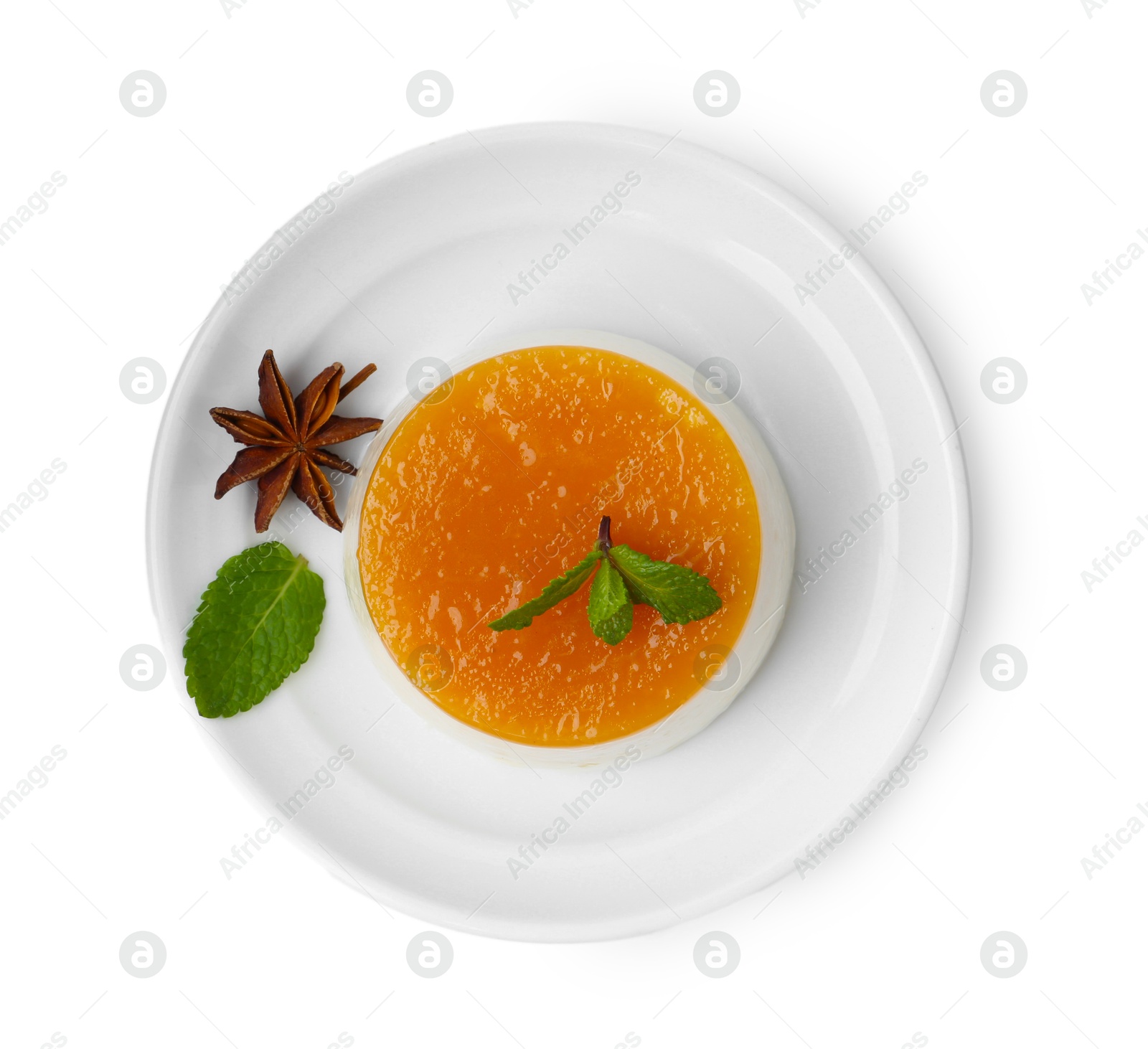 Photo of Tasty pudding with caramel sauce and mint isolated on white, top view