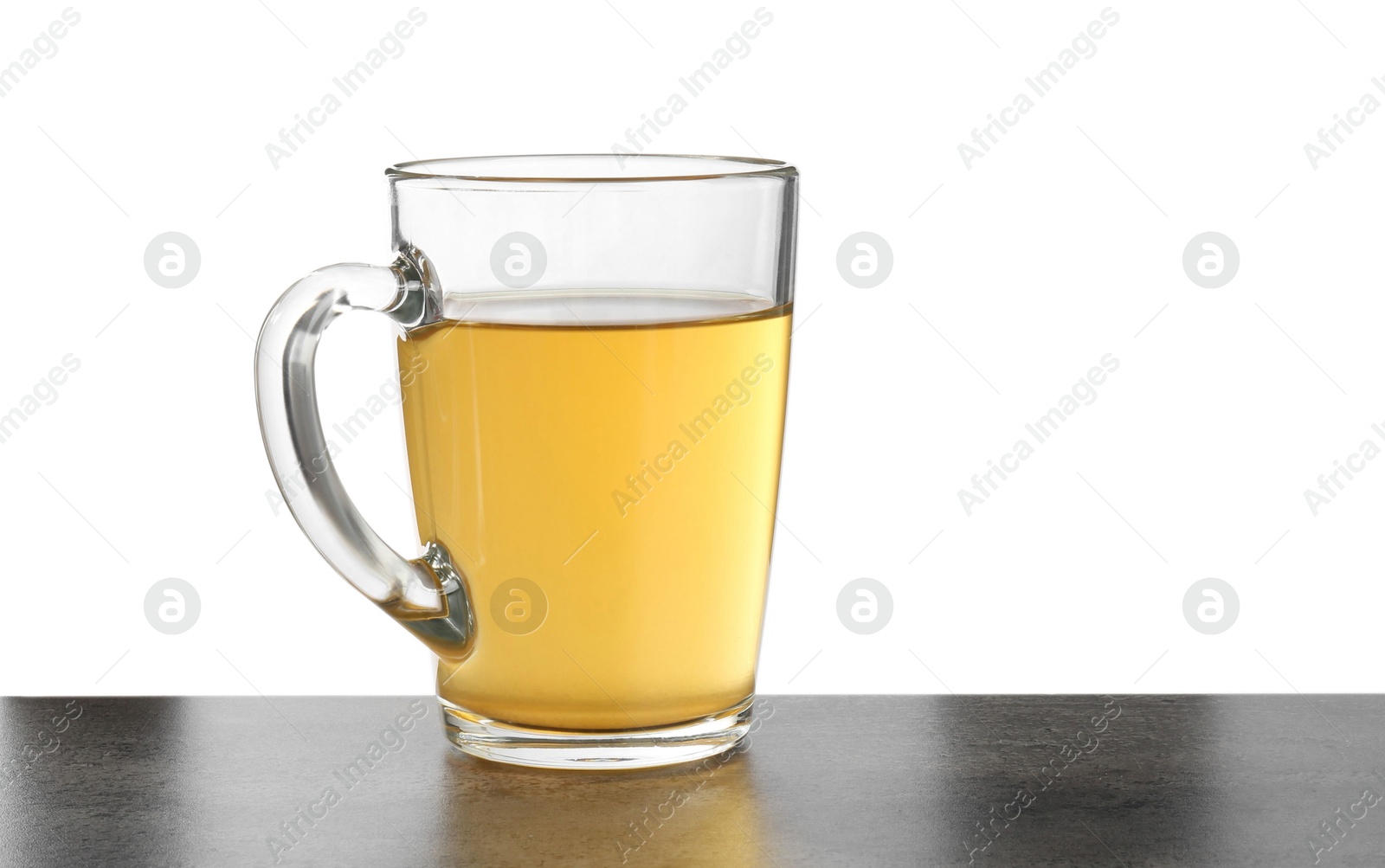 Photo of Refreshing green tea in cup on grey textured table against white background