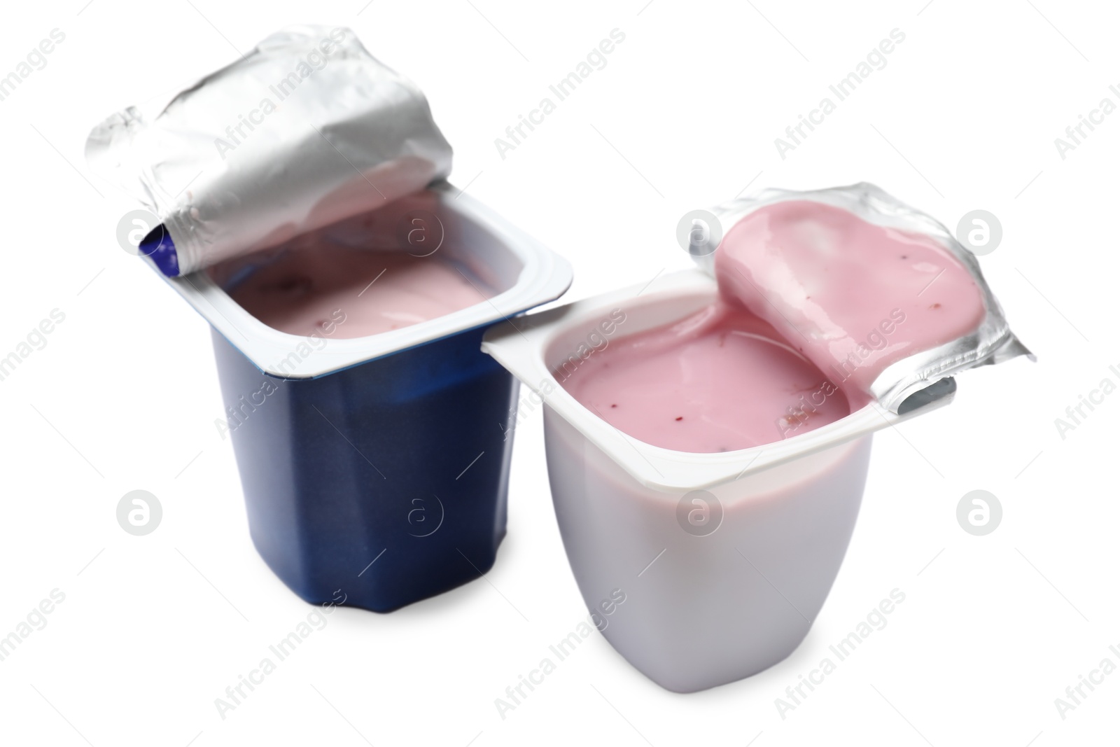 Photo of Delicious yogurts in plastic cups isolated on white