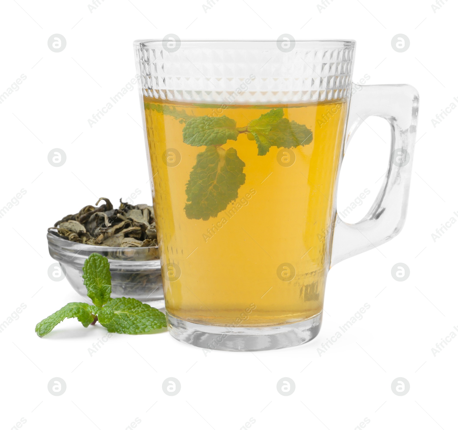 Photo of Aromatic mint tea, fresh and dried leaves isolated on white