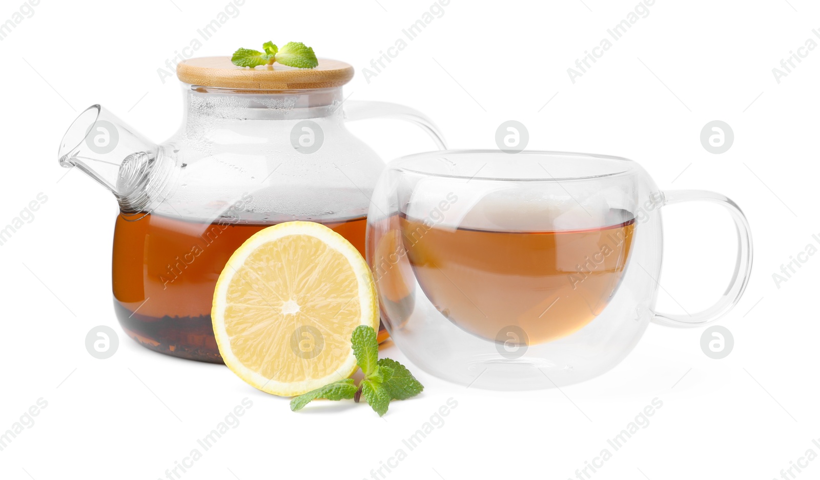 Photo of Tasty mint tea, lemon and fresh leaves isolated on white